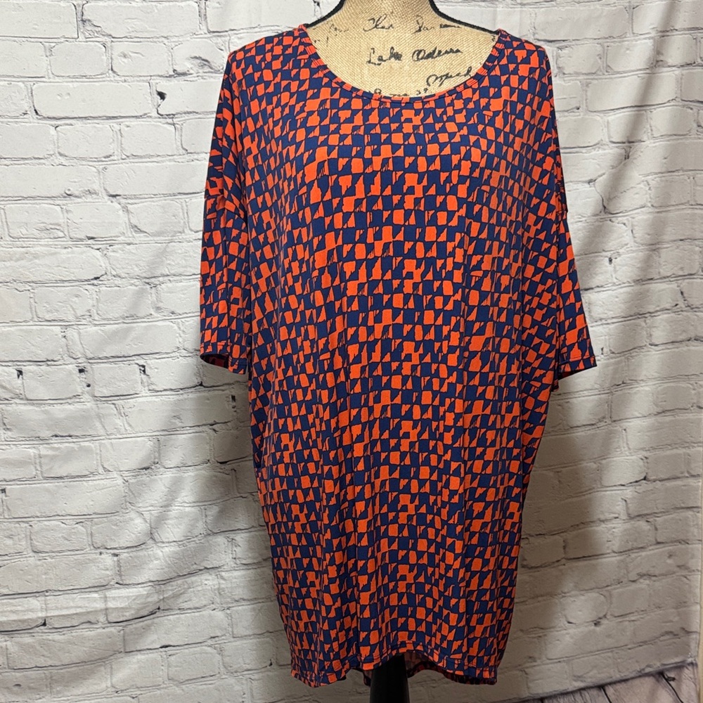 LuLaRoe “Irma” slinky Orange and Blue Patterned Tunic